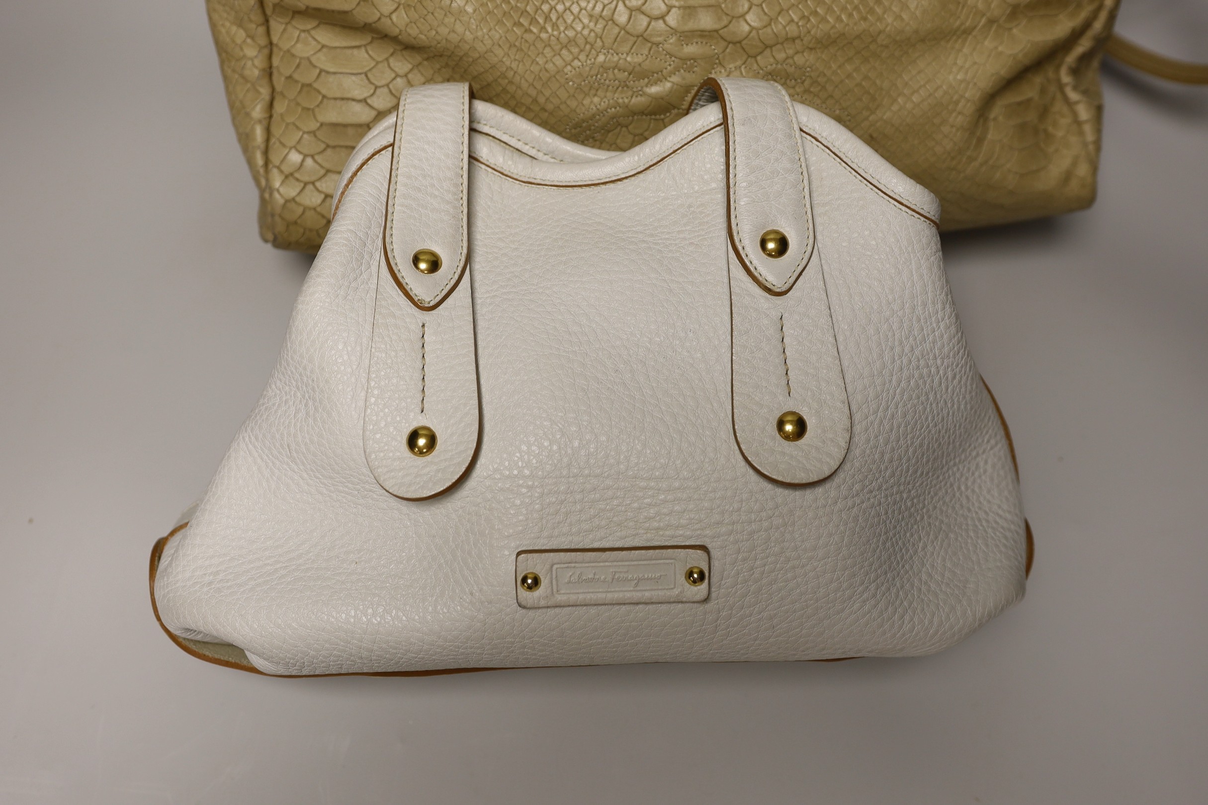 A buffalo tan leather Longchamp Women’s bag, together with a white leather Salvatore Ferragamo Women's shoulder bag. Both with original dust bags